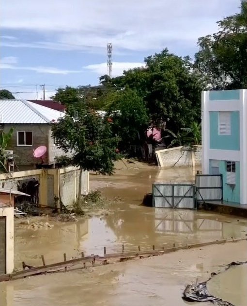 A Montellano neighborhood street covered in thick river mud after the flood.